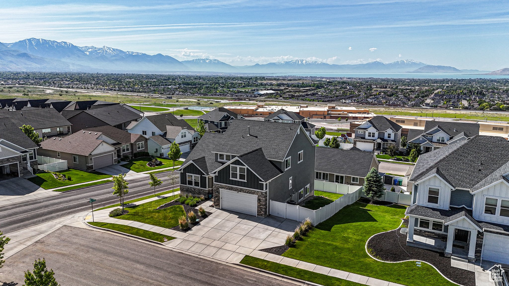 Aerial view of residential area featuring a mountainous background