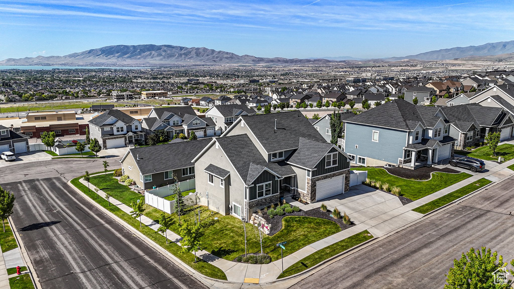 Aerial view of residential area featuring a mountain backdrop