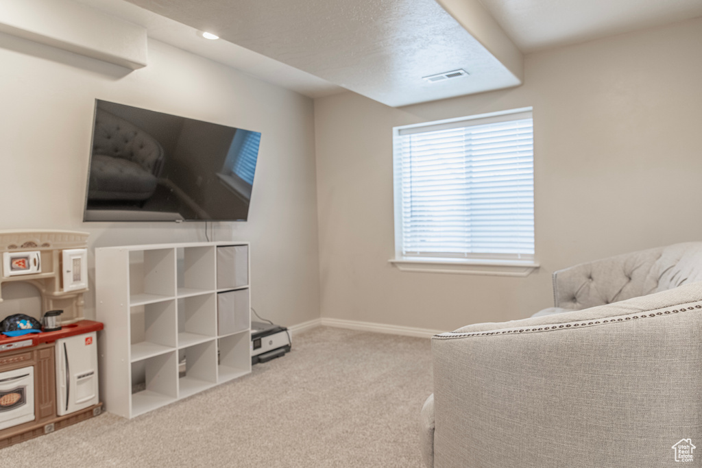 Carpeted bedroom featuring baseboards