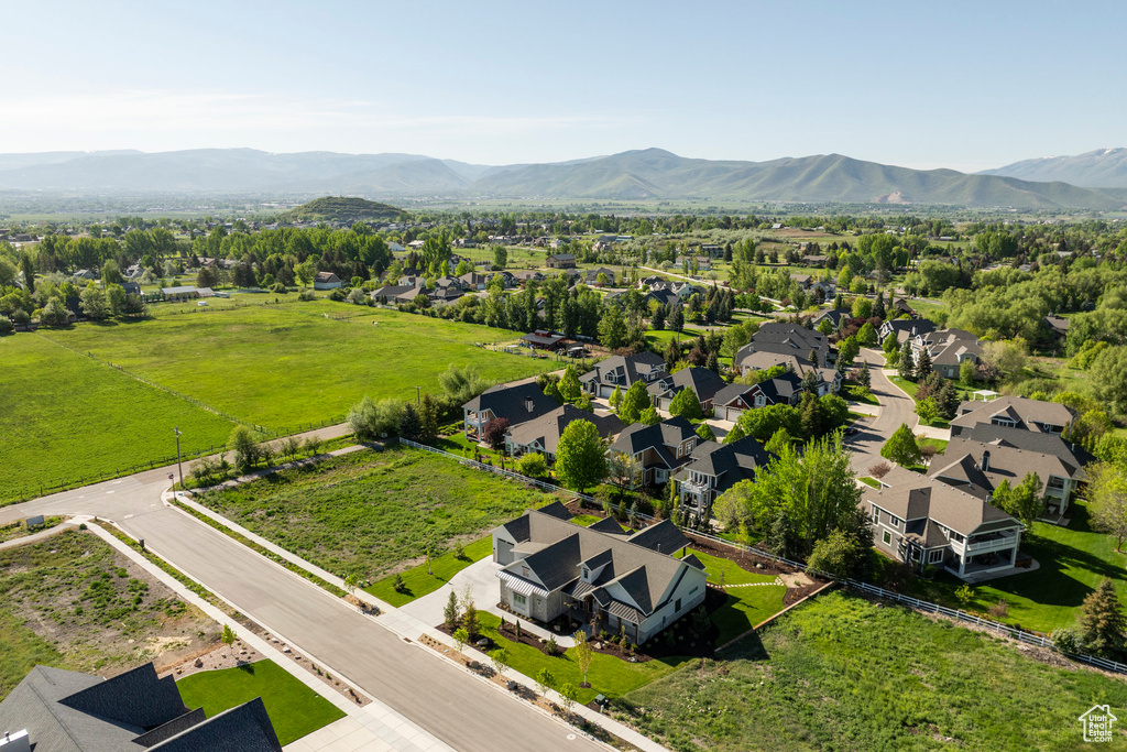 Aerial perspective of suburban area featuring a mountain backdrop