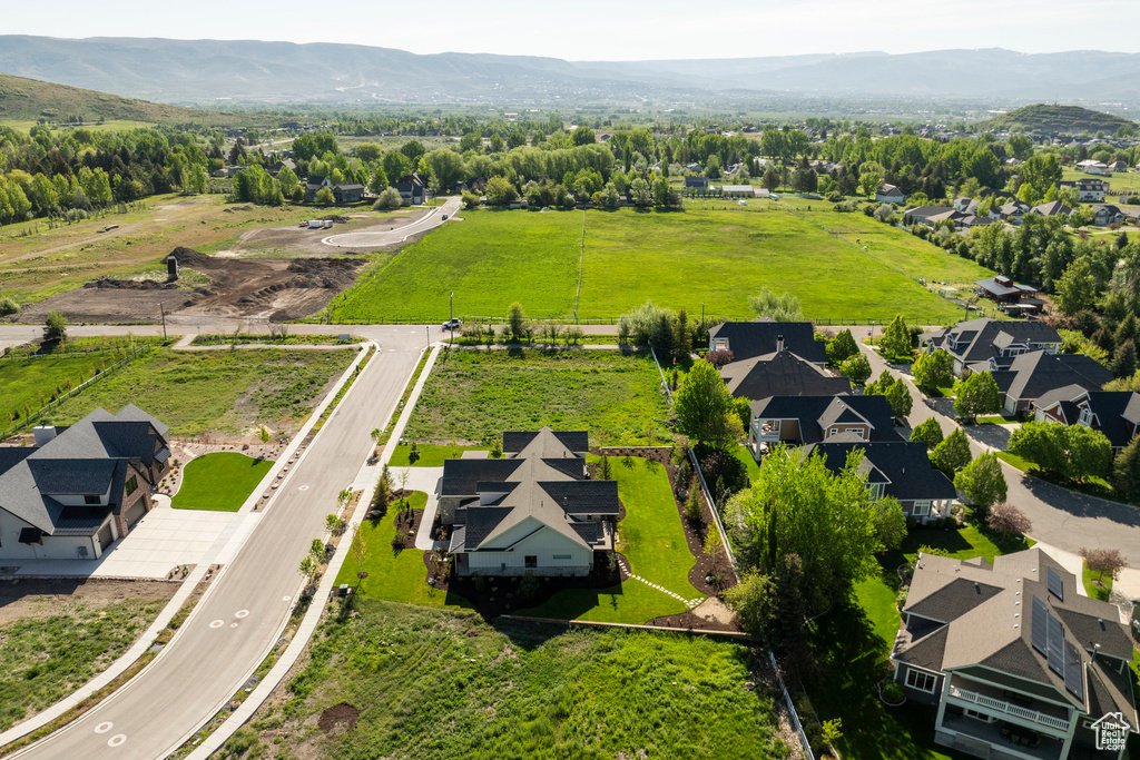 Aerial view of residential area featuring a mountain backdrop