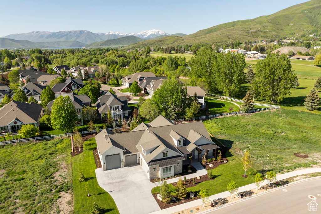 Aerial view of residential area with a mountainous background