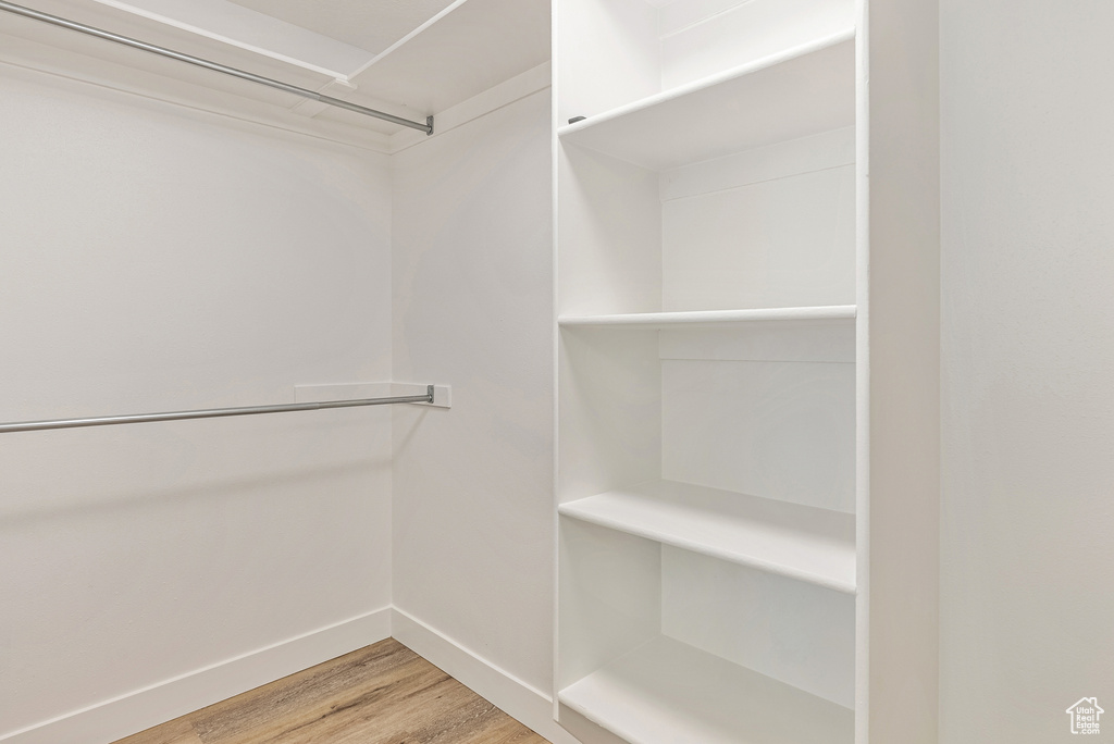 Spacious closet with wood finished floors