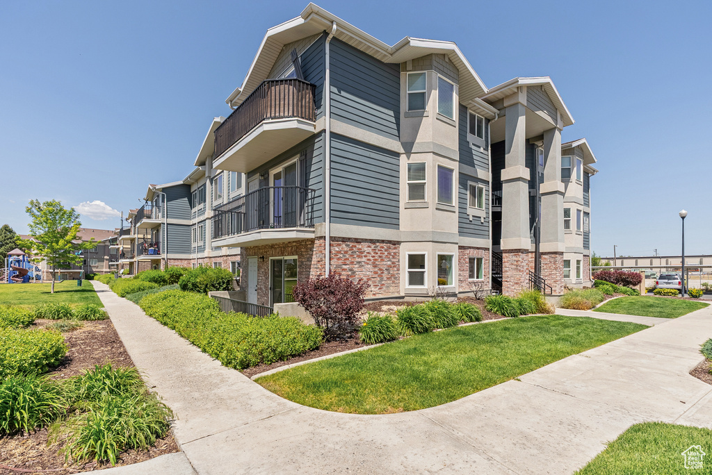 View of property with a residential view