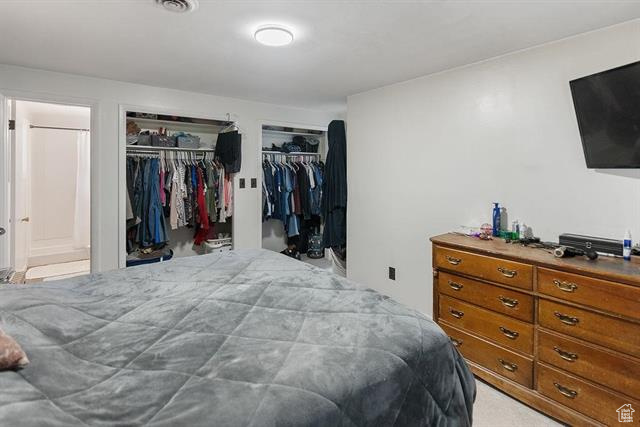 Bedroom featuring two closets