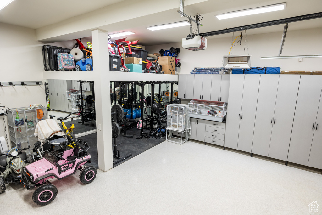 Garage featuring a garage door opener