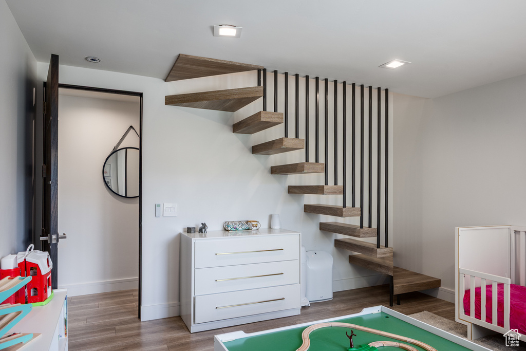 Playroom with baseboards and light wood finished floors