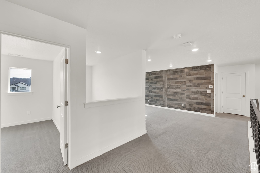 Spare room featuring carpet flooring, recessed lighting, and baseboards