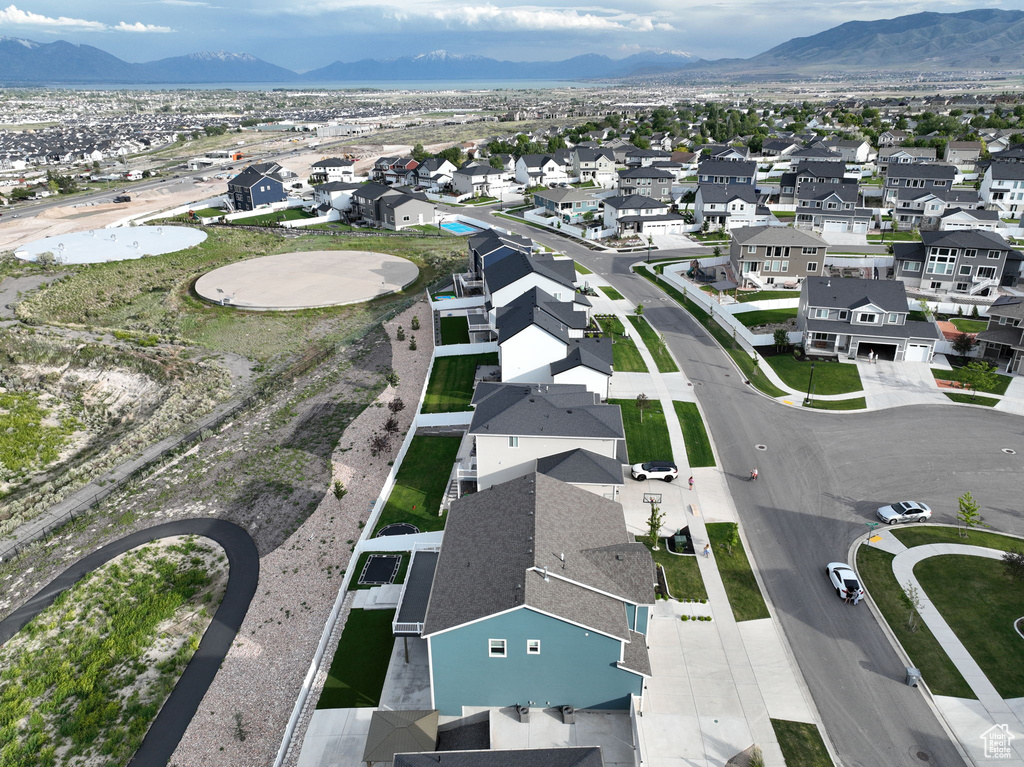 Aerial perspective of suburban area with a mountainous background