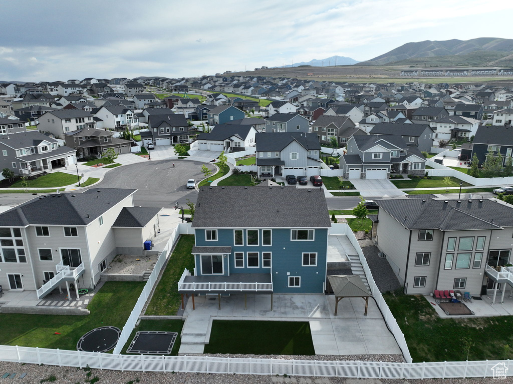 Aerial view of residential area featuring a mountainous background