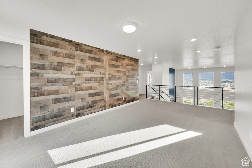 Spare room featuring recessed lighting, carpet floors, and baseboards