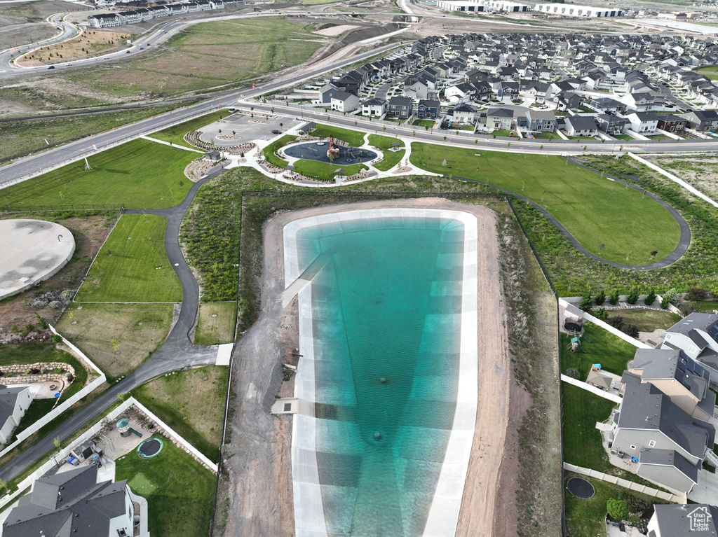 View of property location featuring nearby suburban area and a pool area