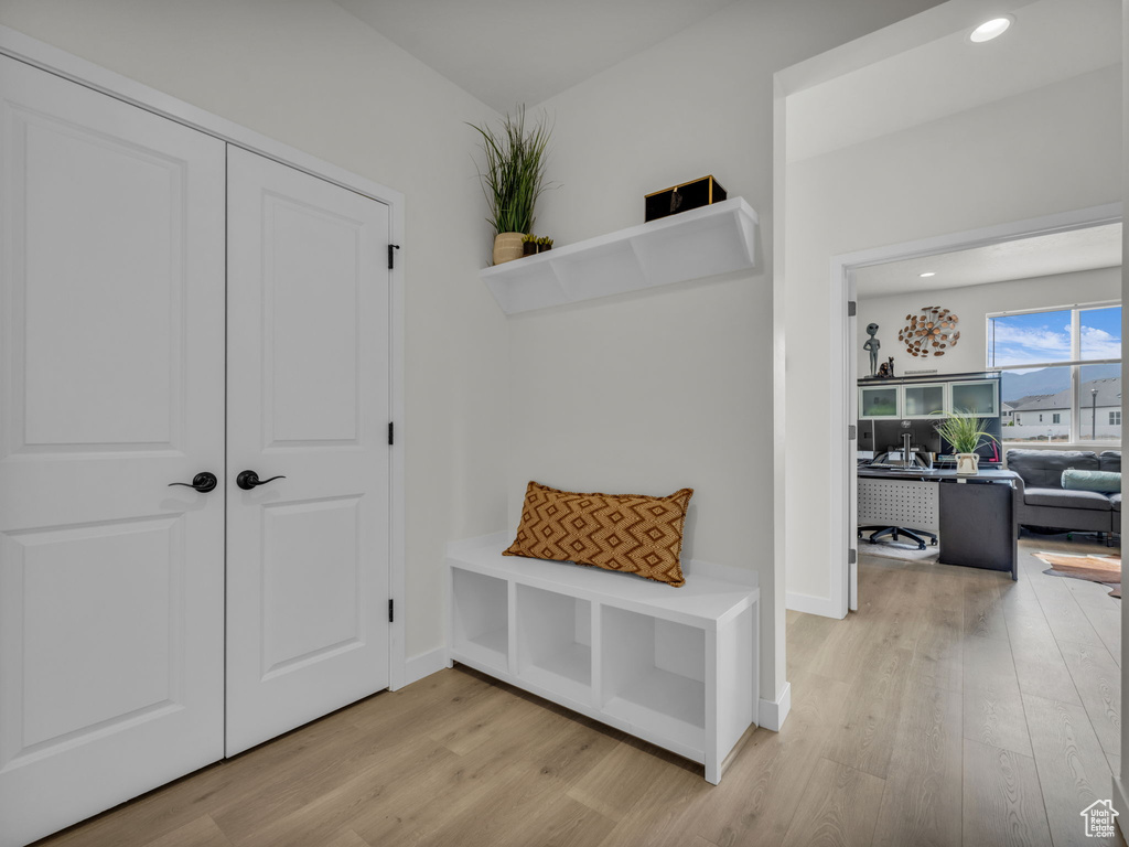 Mudroom featuring light wood-type flooring, recessed lighting, and baseboards