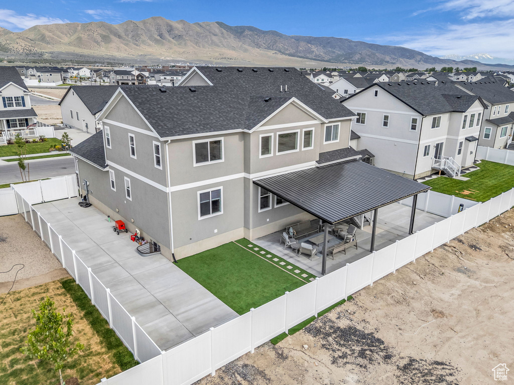 Aerial view of residential area featuring mountains