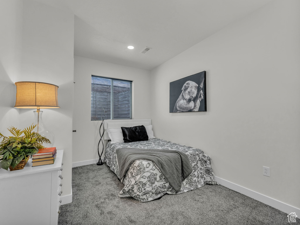 Carpeted bedroom featuring baseboards and recessed lighting