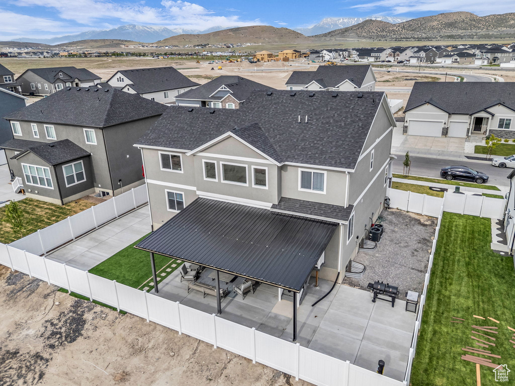 Aerial perspective of suburban area featuring a mountainous background