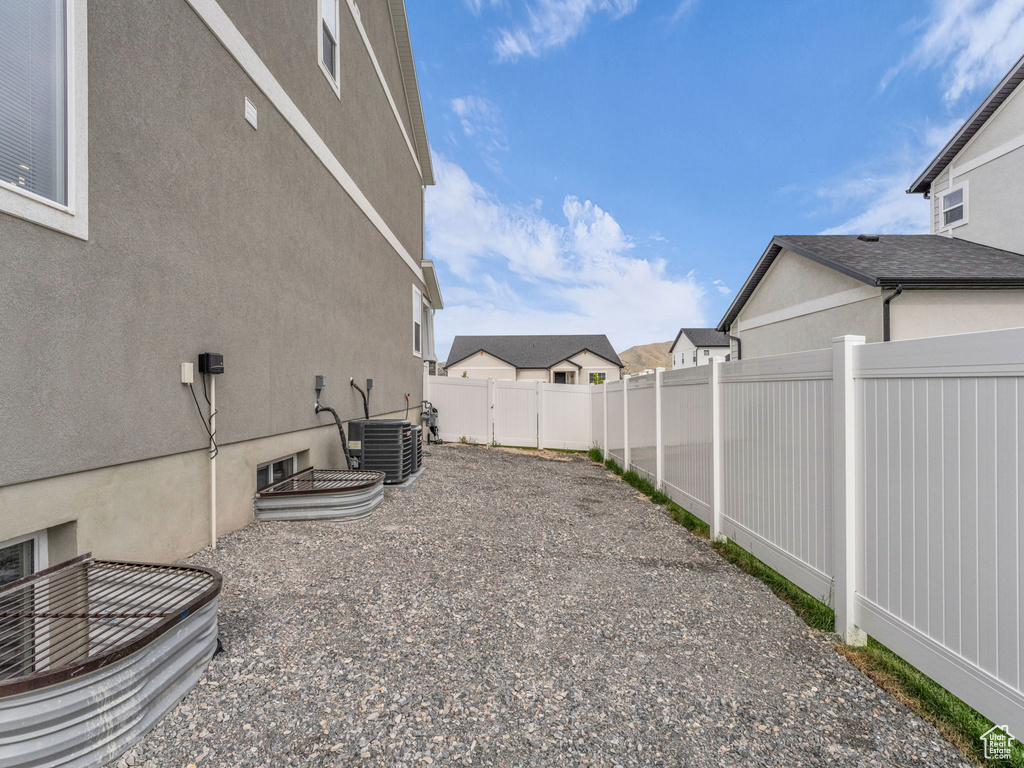 View of yard with central AC unit