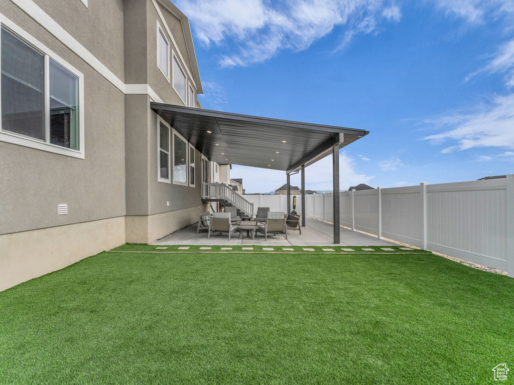 View of yard featuring an outdoor living space and a patio