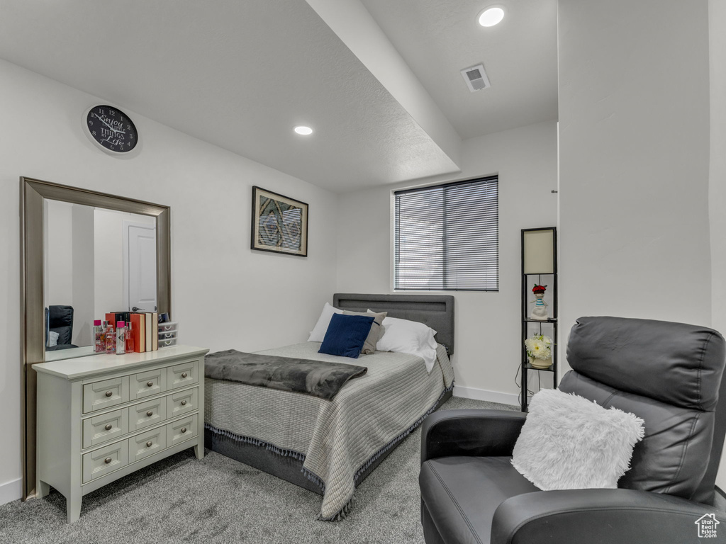 Bedroom with light carpet, recessed lighting, and baseboards