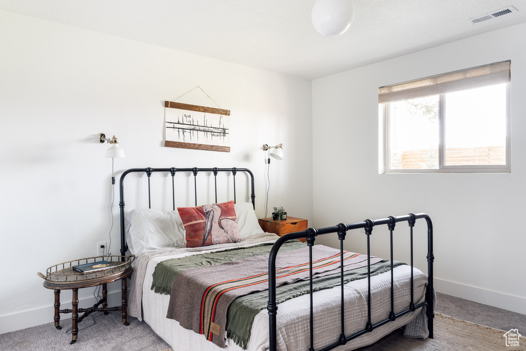 Bedroom with carpet and baseboards