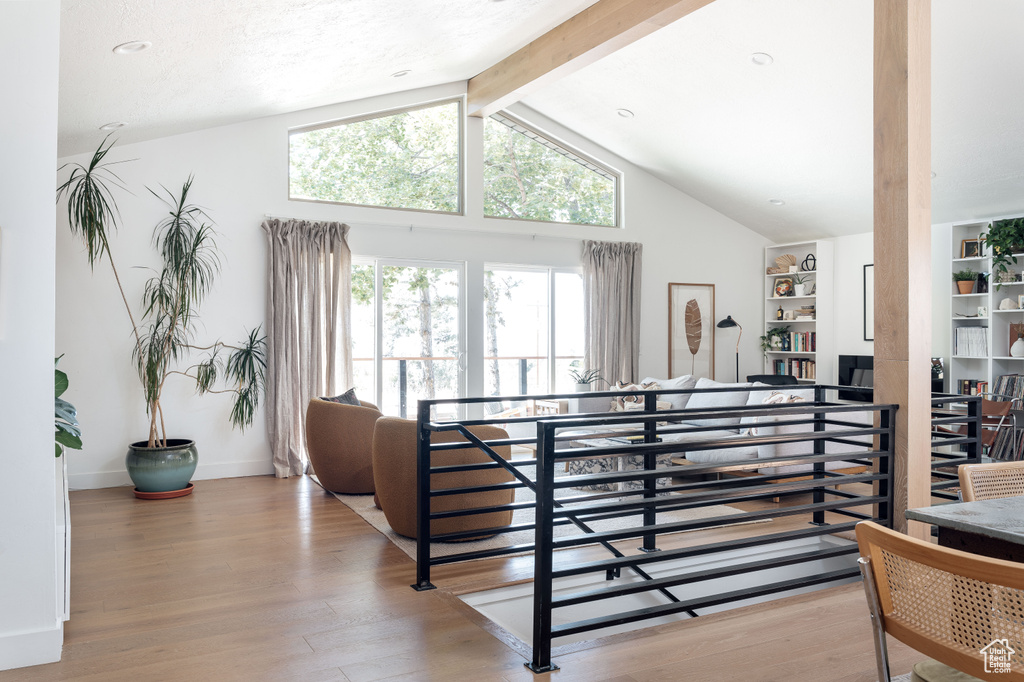 Stairs featuring wood finished floors