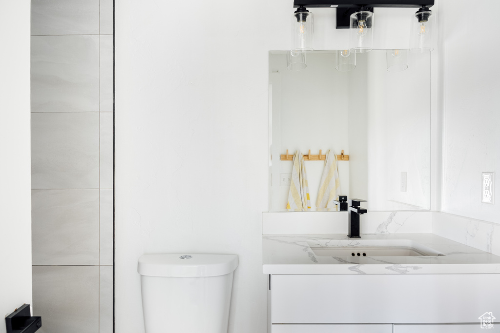 Bathroom featuring vanity and toilet