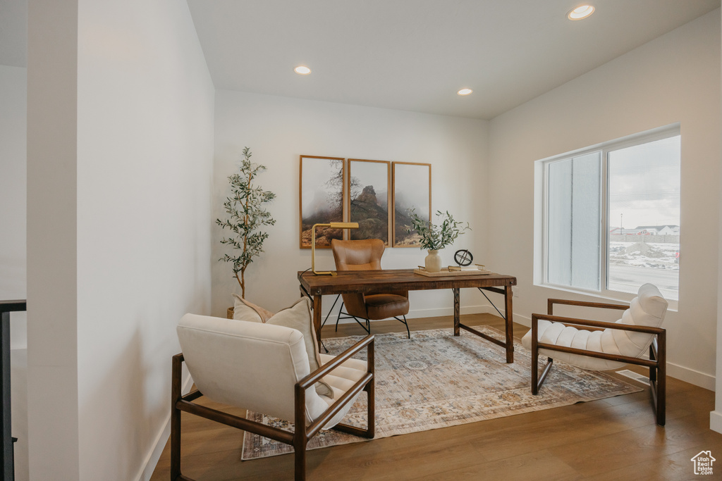 Office area featuring baseboards, recessed lighting, and wood finished floors