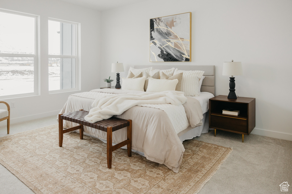 Bedroom featuring carpet flooring and baseboards