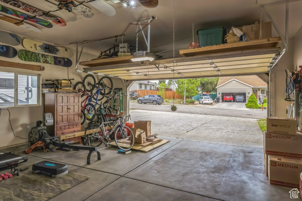 Garage featuring a garage door opener