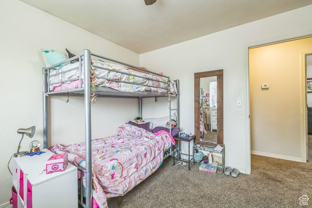 Bedroom with carpet floors and baseboards