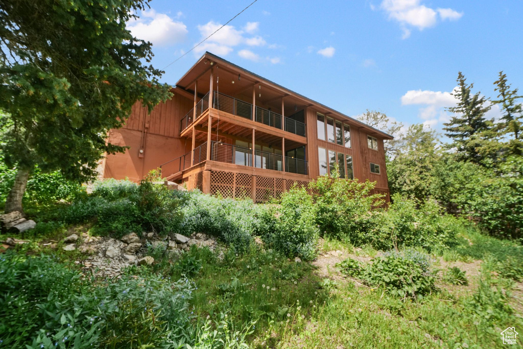 Rear view of house featuring a balcony
