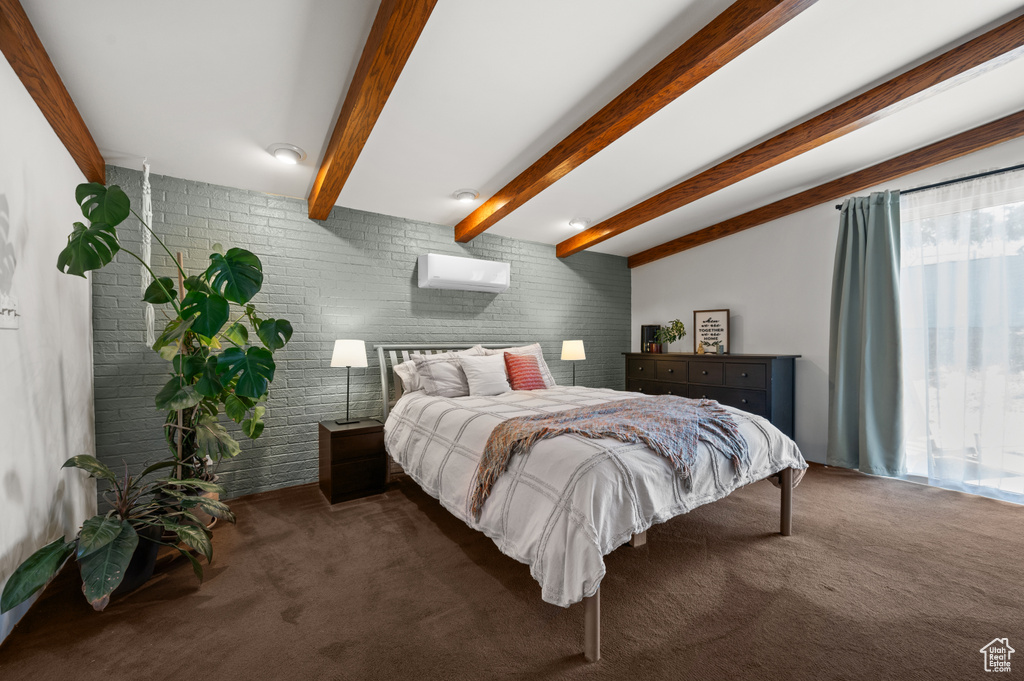 Carpeted bedroom with brick wall, beamed ceiling, and a wall mounted air conditioner