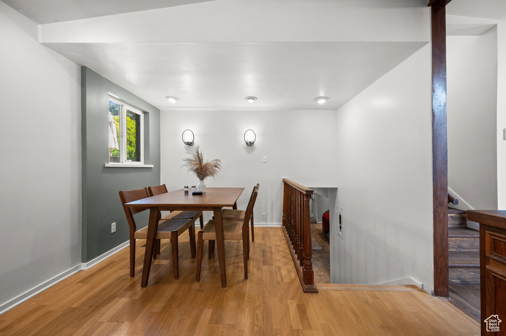 Dining room featuring wood finished floors and baseboards