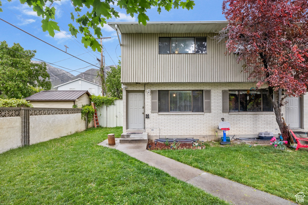 View of front of home featuring brick siding