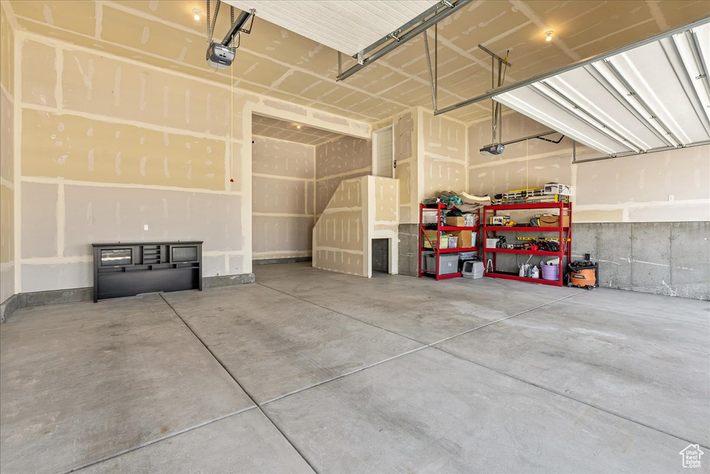 Garage featuring a garage door opener