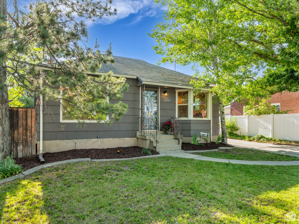 View of front of property featuring a shingled roof