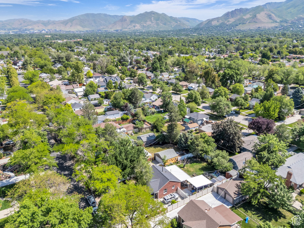 Aerial perspective of suburban area with a mountainous background