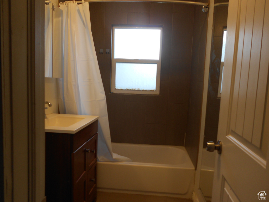 Full bathroom with vanity and shower / tub combo with curtain
