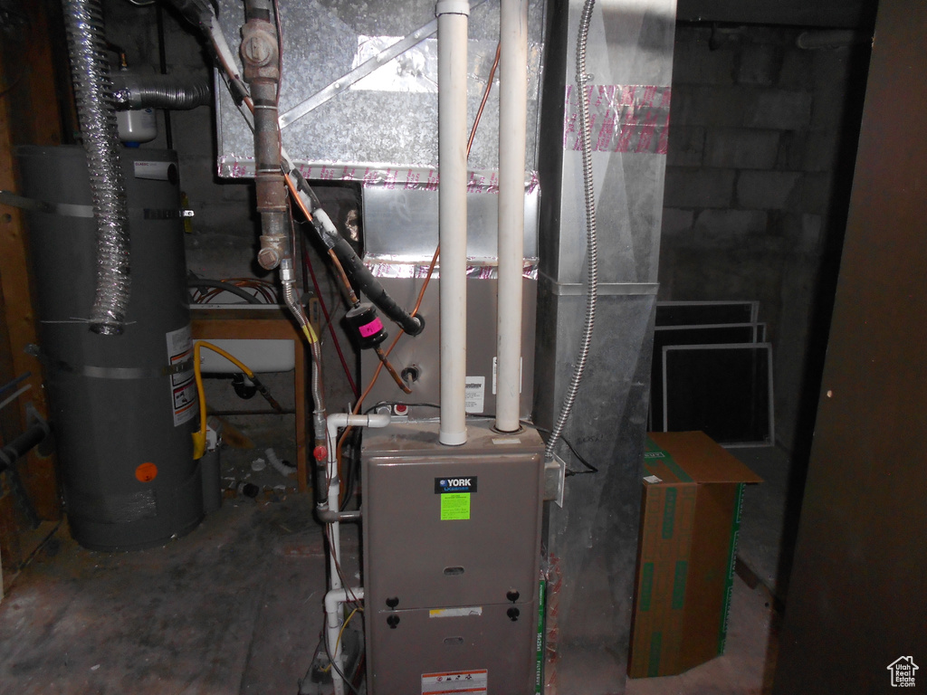 Utilities featuring strapped water heater and heating unit