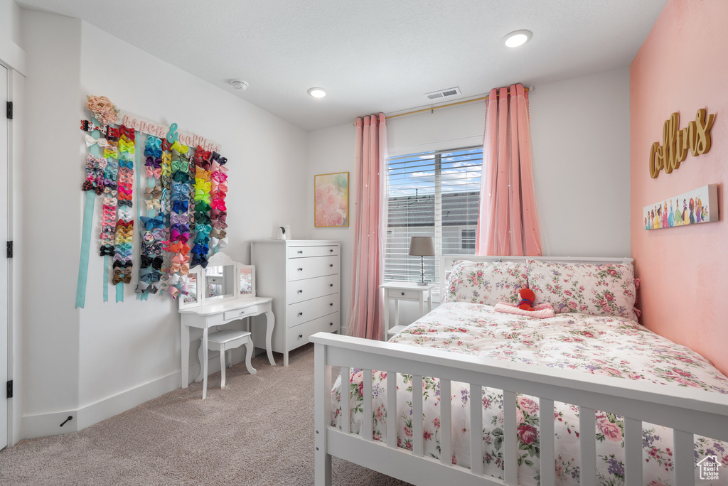 Carpeted bedroom featuring recessed lighting and baseboards