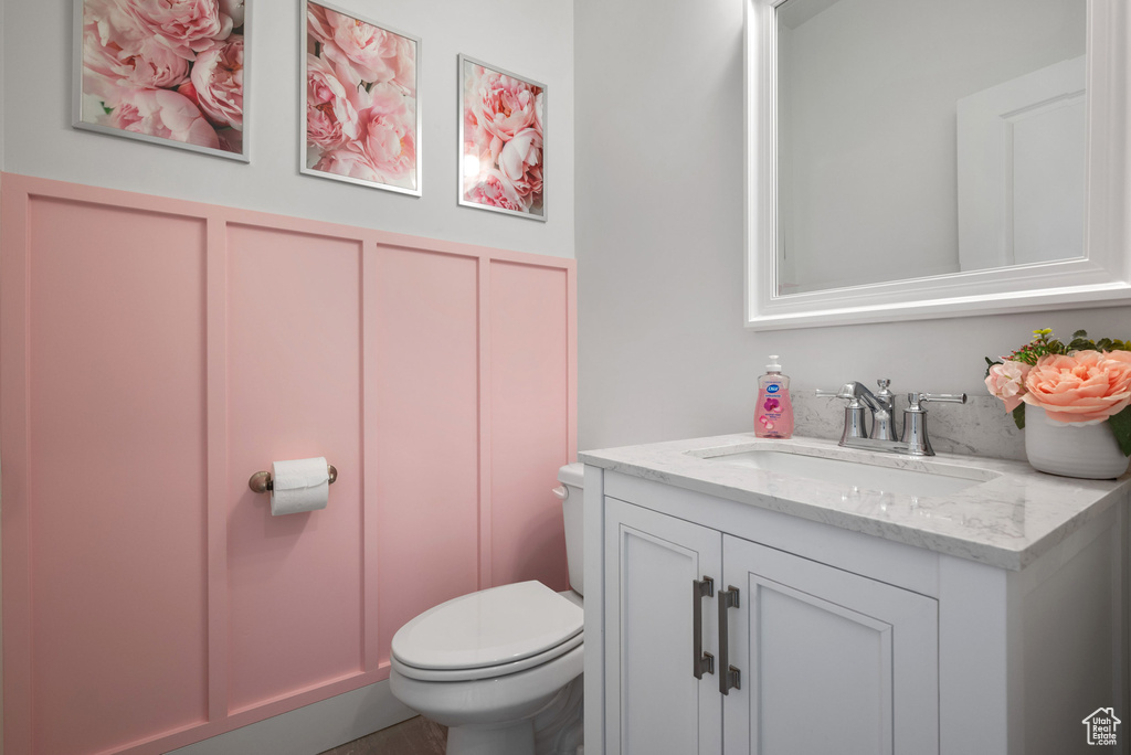 Half bath with vanity and toilet
