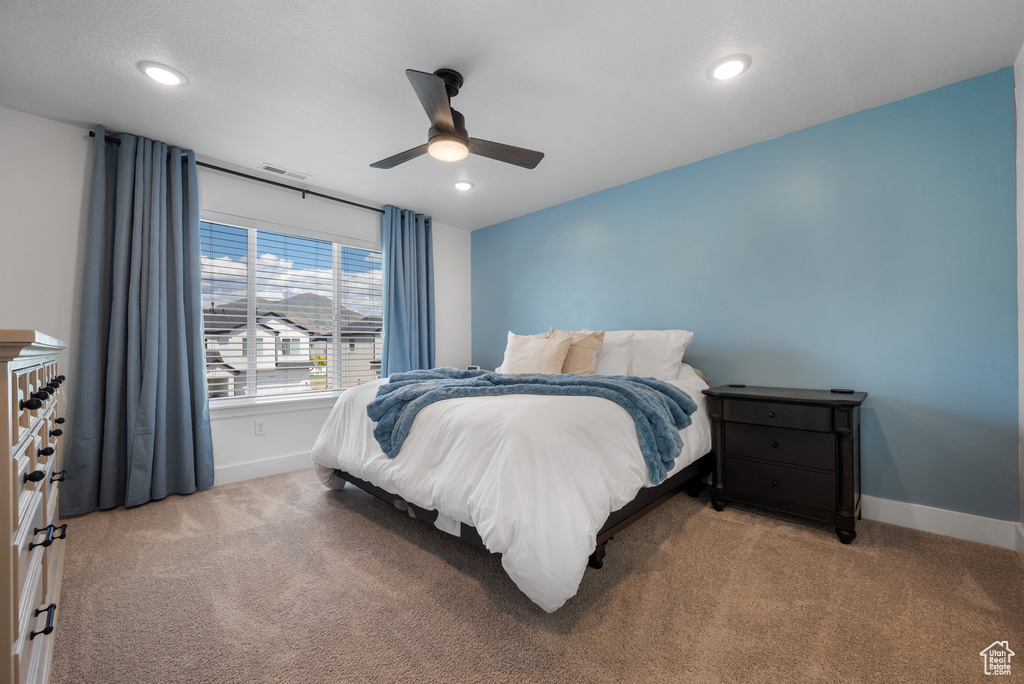 Bedroom with carpet flooring, baseboards, recessed lighting, and a ceiling fan