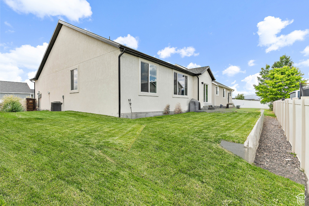 Rear view of house with stucco siding