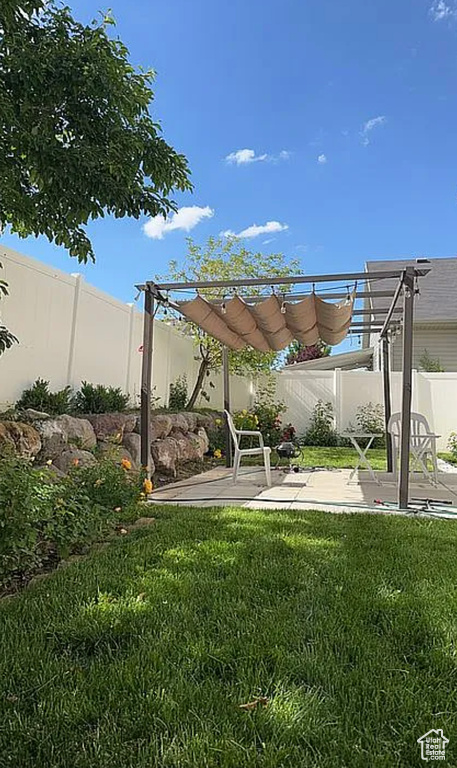View of yard featuring a pergola and a patio area