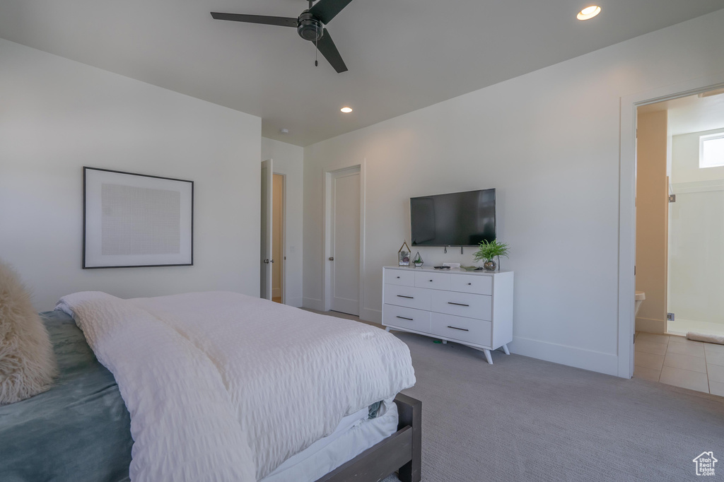 Bedroom featuring light carpet, recessed lighting, baseboards, ensuite bath, and ceiling fan