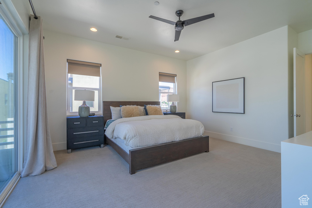 Bedroom featuring light colored carpet, baseboards, recessed lighting, and ceiling fan