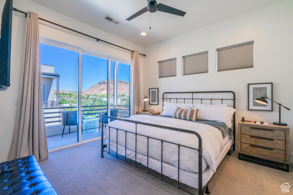 Bedroom with carpet flooring, access to exterior, a mountain view, recessed lighting, and a ceiling fan