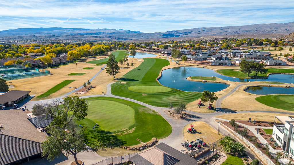 Aerial perspective of suburban area featuring a water and mountain view and a golf course