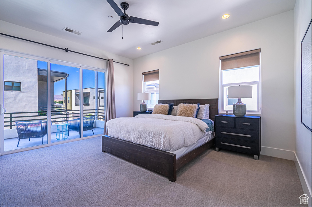 Carpeted bedroom featuring access to outside, multiple windows, recessed lighting, a ceiling fan, and baseboards