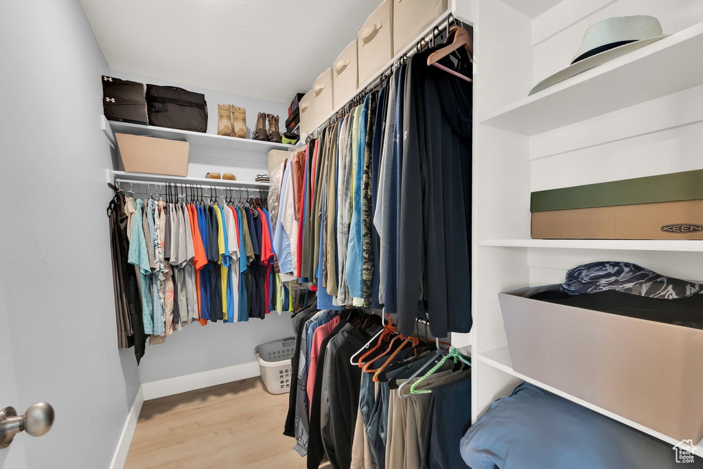 Walk in closet featuring wood finished floors